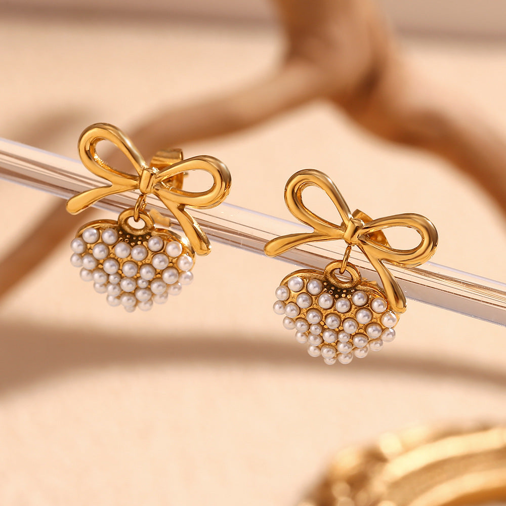 In love bow heart pearl earrings
